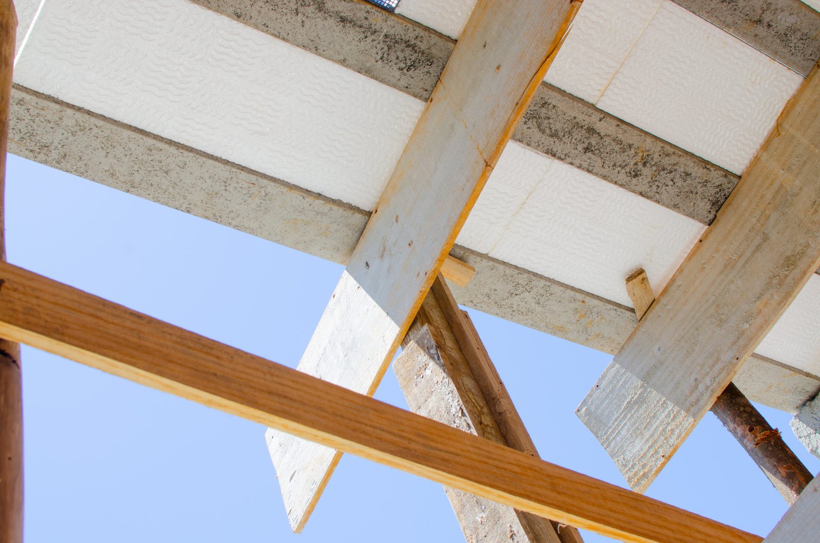 Cement slab and styrofoam under construction at home or building. Styrofoam slab reinforced with hardware under construction. The styrofoam slab is resistant to impacts, sunlight, rain and moisture.